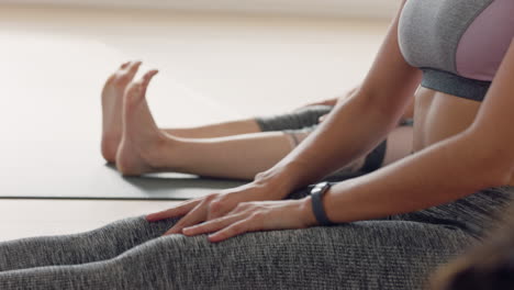 yoga class attractive woman stretching legs enjoying warm up preparing for exercise in fitness studio