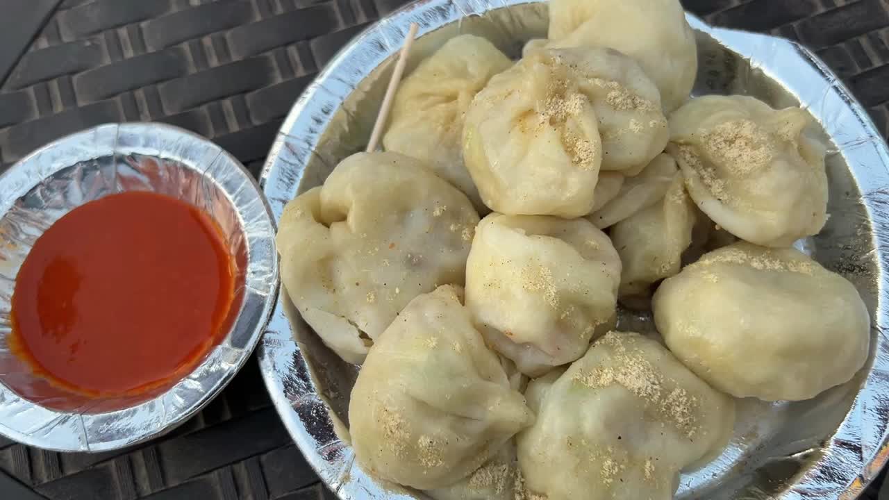 Closeup shot of veg Momo served with spicy chutney. Indian dish.