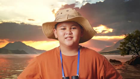 happy boy explorer at sunset