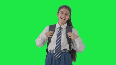 Happy-Indian-school-girl-laughing-hard-on-someone-Green-screen