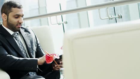 middle eastern businessman downtown using wireless tablet device