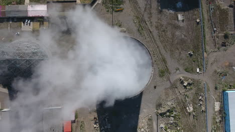 steam coming out of a cooling tower coal thermal power station in mongolia.