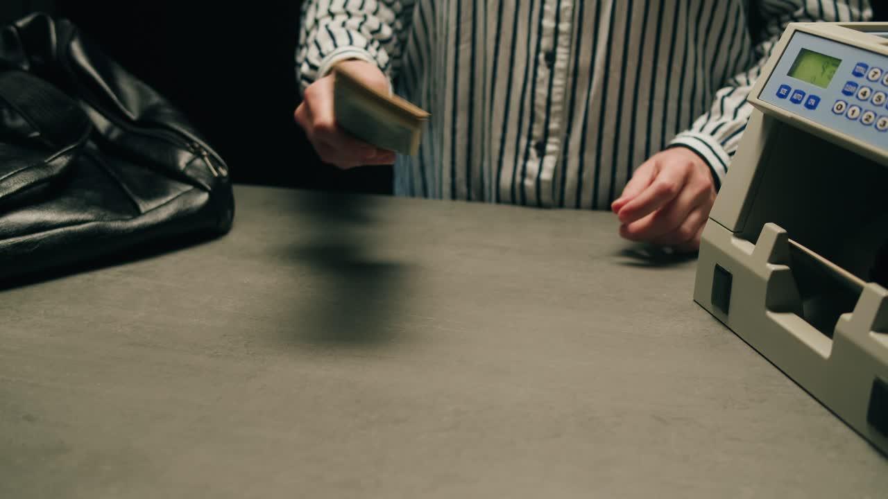 Specialised police officer Counting dollar banknotes in crime lab, conceptual image. High quality 4k footage