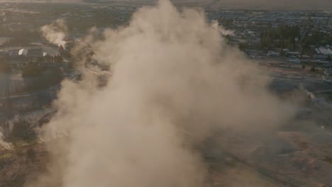 steam rising from the ground in hveragerdi geothermal area in south iceland