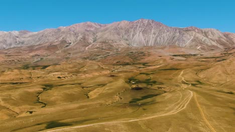 Picturesque-Landscape-Of-Mountains-And-Green-Lowland-In-Foreground-In-Summer-In-Uzbekistan