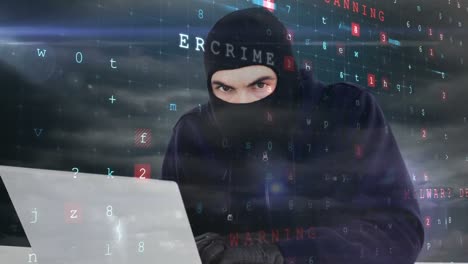 digital animation of hacker in black clothes hacking the laptop in data center 4k