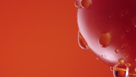 water droplets on a red tomato