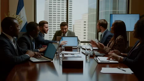 business professionals holding a meeting in a modern conference room