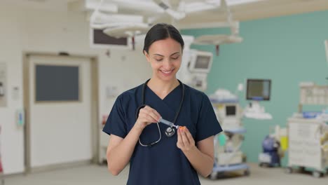 happy indian female doctor giving vaccine