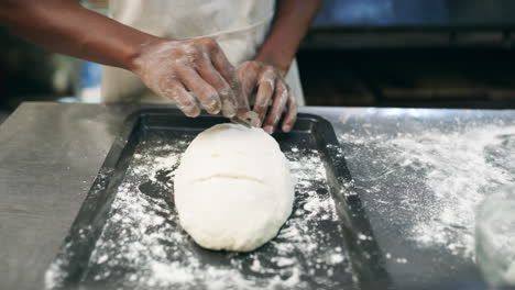 baker preparing bread in a commercial kitchen