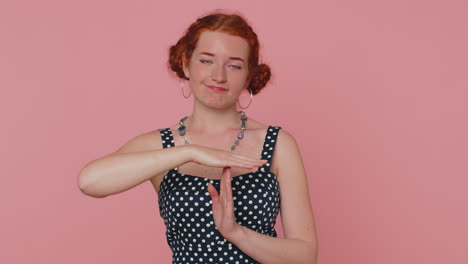 tired serious upset young redhead woman in dress showing pause gesture, limit or stop sign, time out