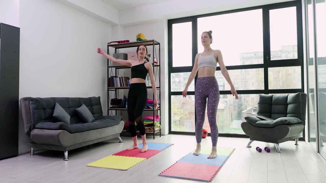 Women Exercising Yoga at Home