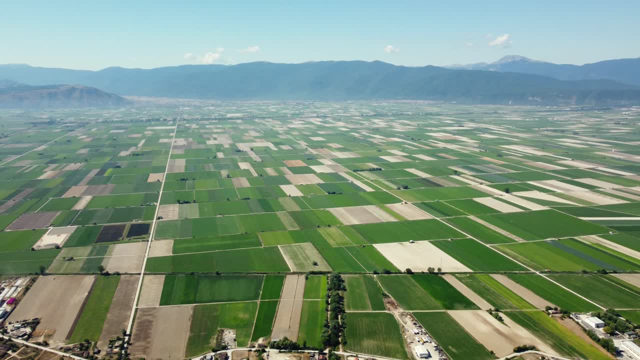 Aerial View of Farmland with Mountains in the Background