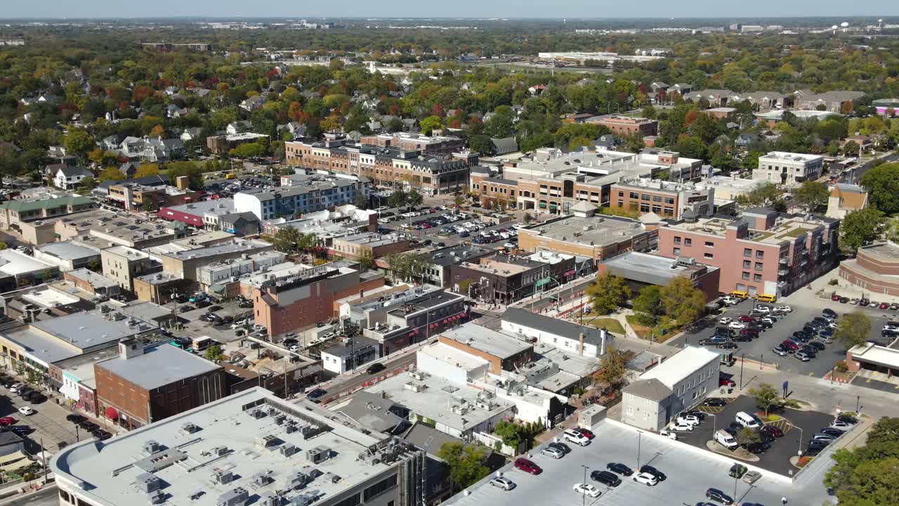 Naperville, IL, a Chicago suburb, on a sunny fall day, featuring buildings, streets. Orbit Left Zoom Day NW