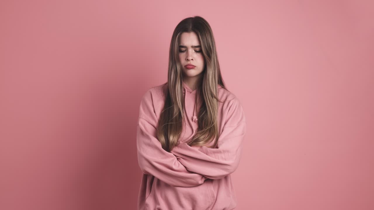 Angry young beauty woman standing with arms crossed