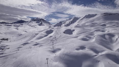 ski tourists skiing down the ski slope - dolly in shot and panning shot - shot in tignes and val d'isere