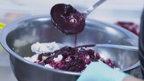 preparing a blueberry cream cheese dessert