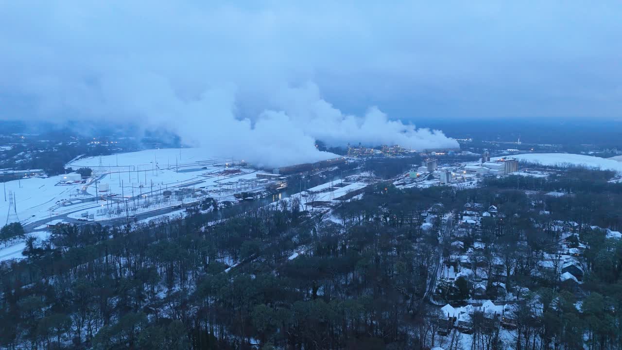 Aerial shot pushing in on snow covered Georgia Power Plant on the evening of January 10th 2025.