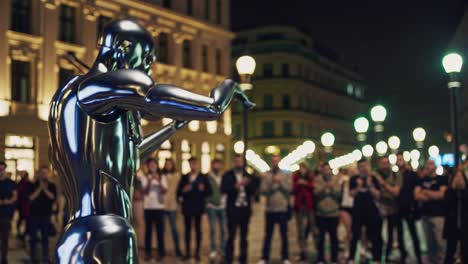 robot violinist in city street at night