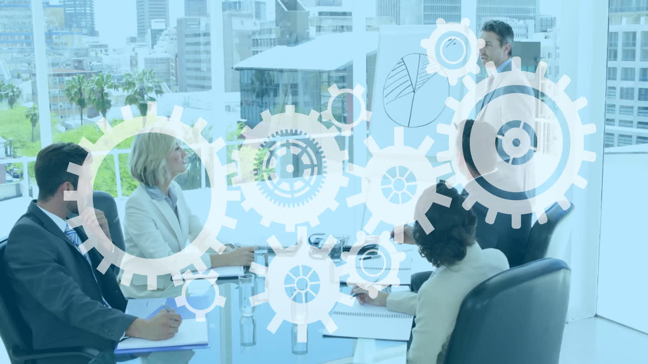 In office, business meeting with gear animation overlaying participants at table