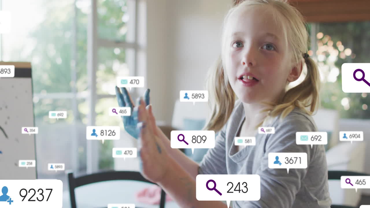 girl raising painted hands by laptop in home, displaying social media marketing metrics overlays
