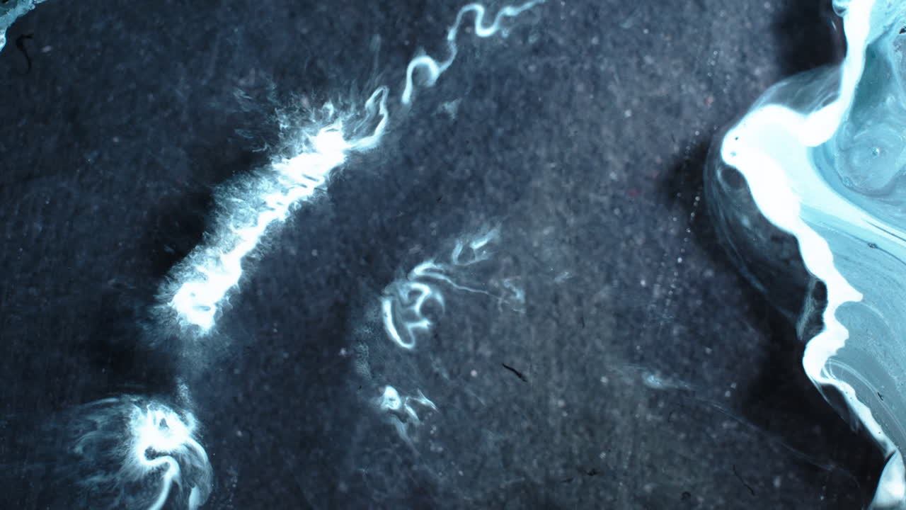 Macro shot of substances swirling, a mesmerizing blending effect