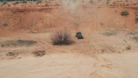 Aerial-View-of-ATV-Four-Wheeler-Doing-Down-on-Dusty-Hill-in-Zion-National-Park,-Utah-USA-60fps