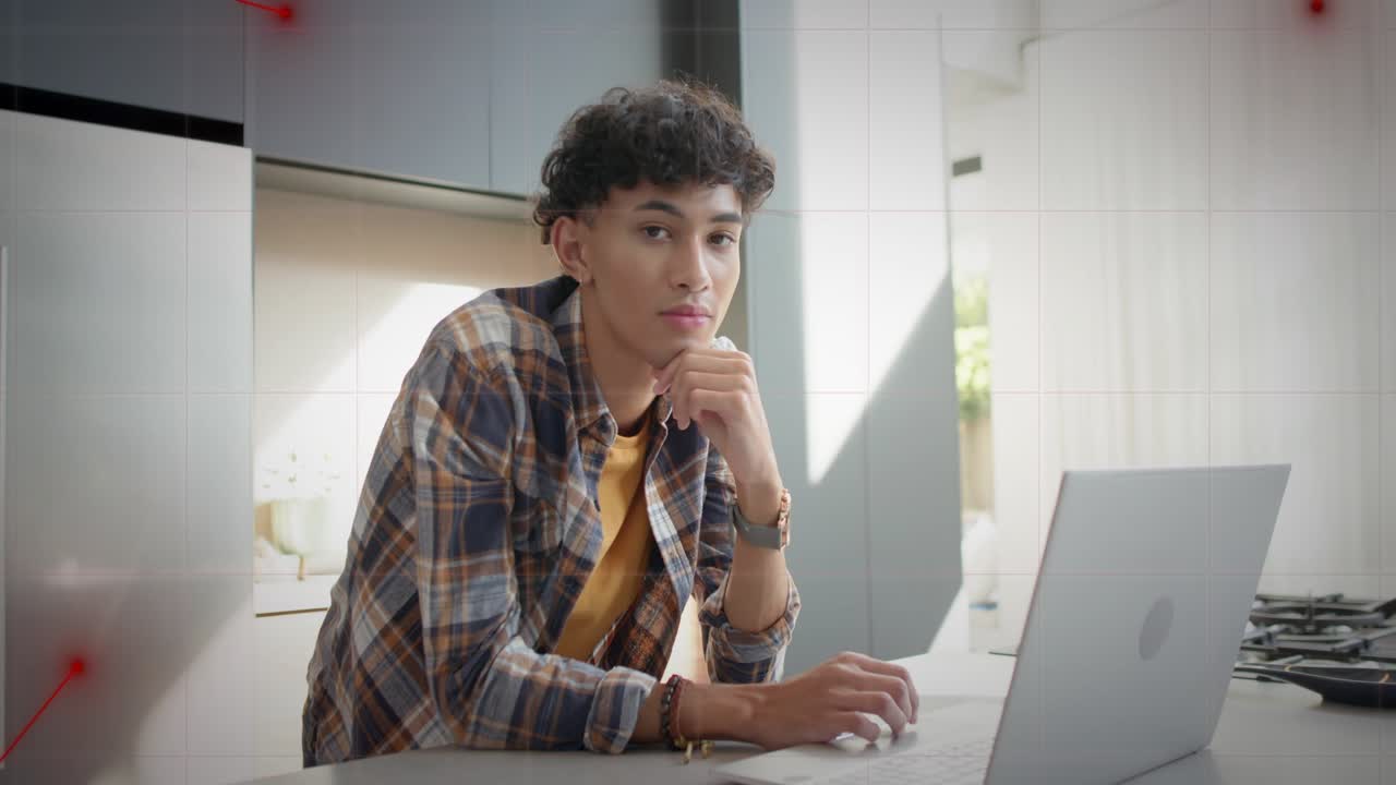 Remote worker reacting to animated red lines tracing toward laptop, typing testing tech in kitchen