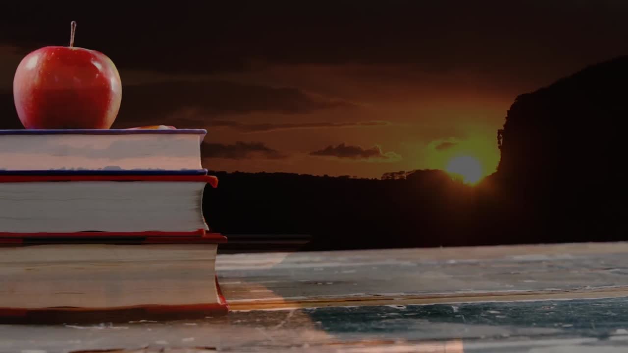 책의 애니메이션과 풍경 위의 사과