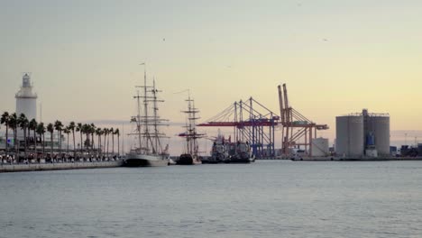 malaga port and promenade on evening, spain, costa del sol