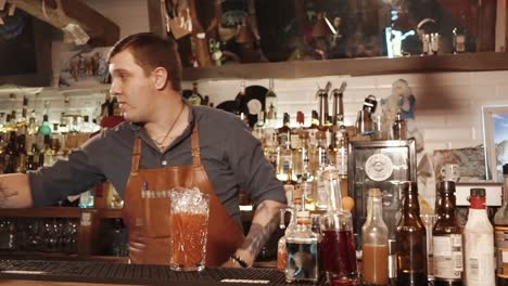 bartender preparing cocktails at a bar