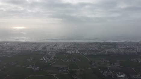 180 degrees pan to the left of the beautiful coastline in portugal on a misty morning.