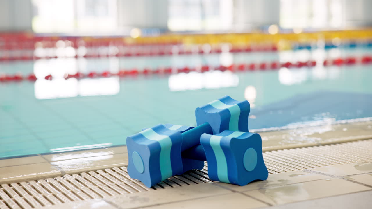 Aqua dumbbells by the pool
