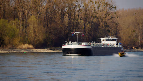 industrial transport ship sailing with gas or liquids on the rhine near karlsruhe, germany