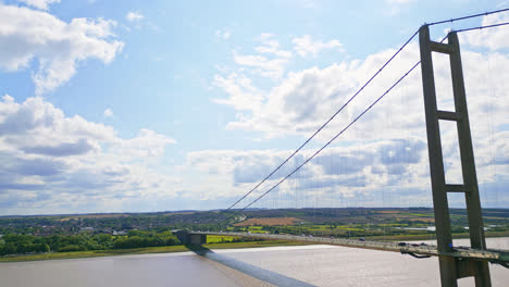 aerial drone video of humber bridge: river, traffic, lincolnshire to humberside