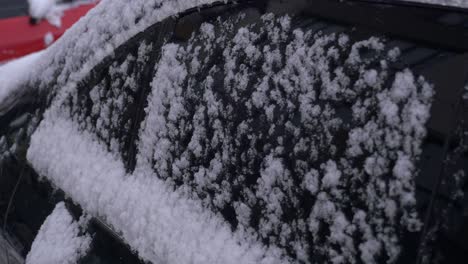 snow-covered car window