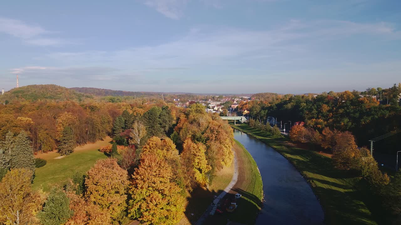 Colourful Komensky park golden autumn trees on River Ostravice AERIAL