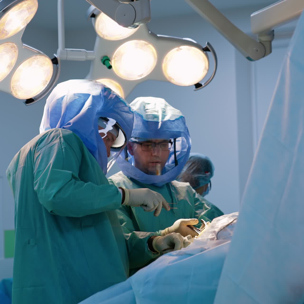 Surgeon orthopedists use metal tool at operation. Modern orthopedic operation for trauma healing