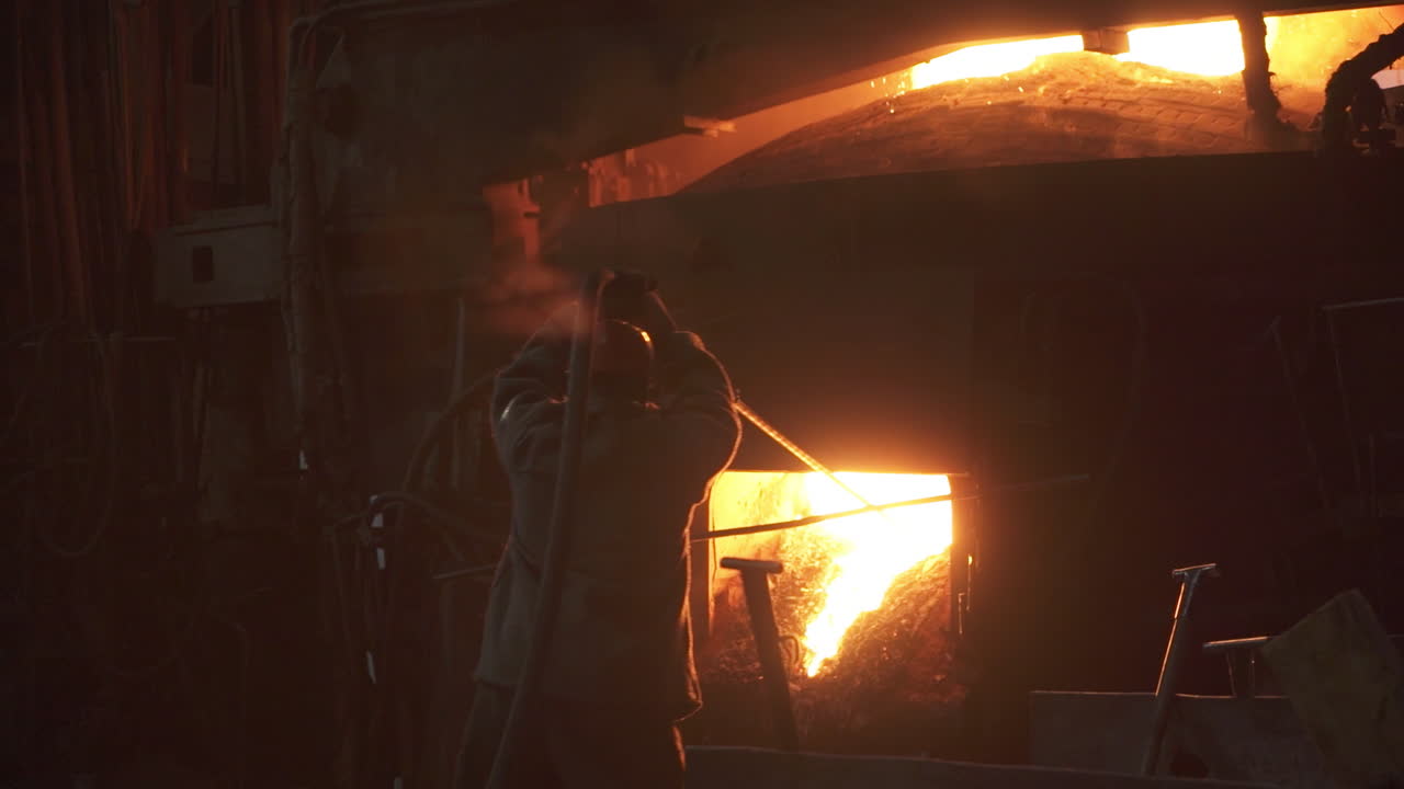 Metalworker Operating a Furnace
