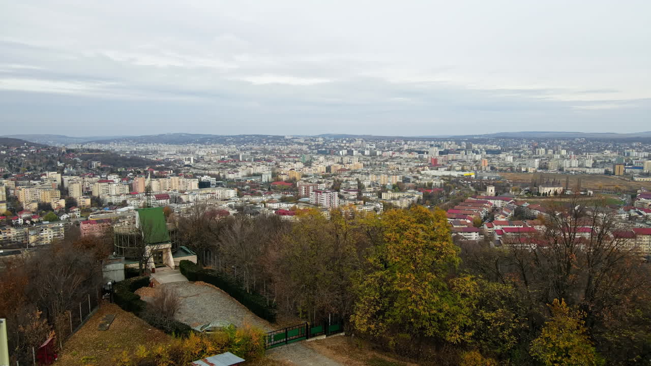 Aerial drone view of Iasi from the Cetatuia Monastery in Romania. Multiple buildings and bare trees