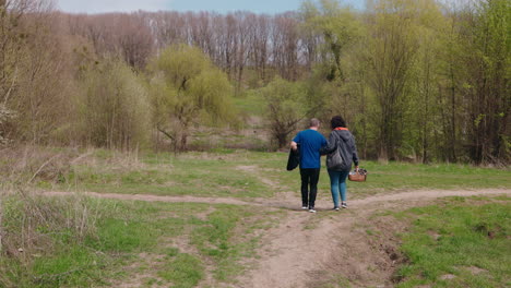 couple walking in a spring woods