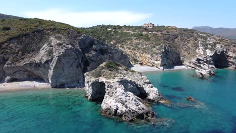 aerial view over rocky kaladi beach with turquoise waters in kythira island, greece