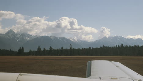 Wing-of-small-plane-travelling-along-the-runway-of-an-airport