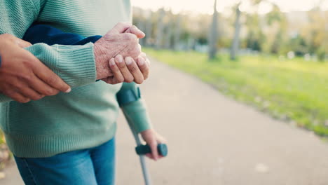 hands, caregiver and helping a patient in outdoor