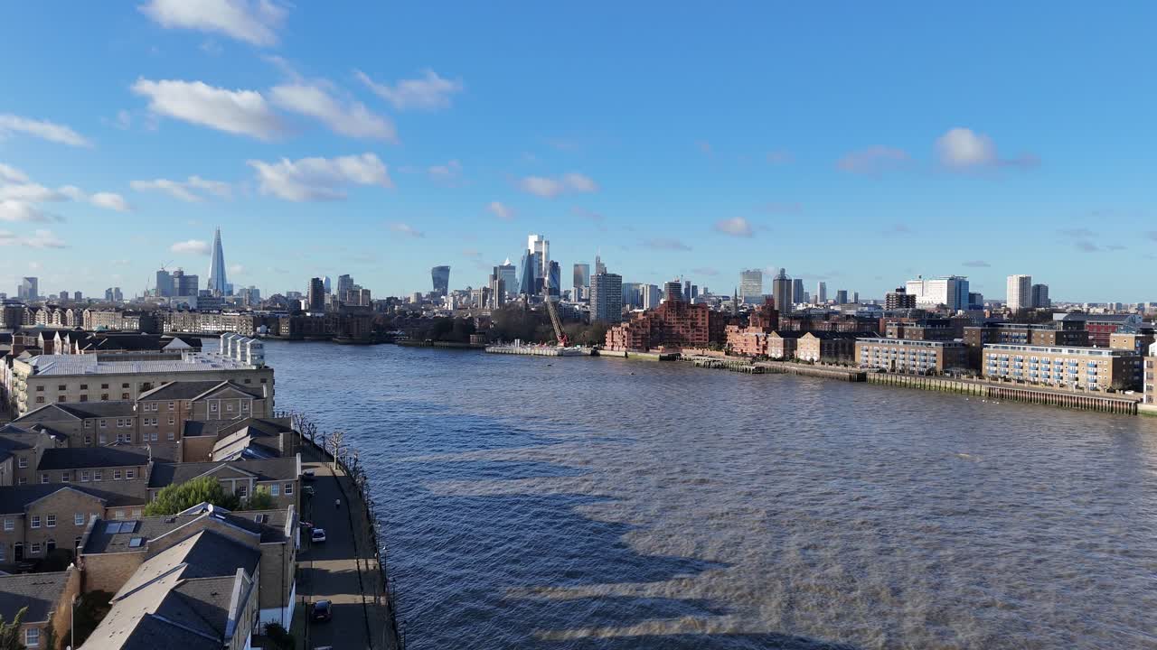Panning aerial River Thames riverside apartments Rotherhithe London UK