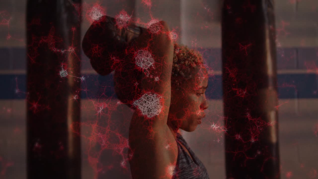 Gym athlete doing overhead move, on inhale, pushing bag up for strength, red overlay showing motion