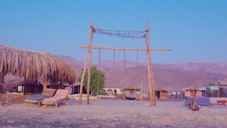 ocean swing set with mountain view