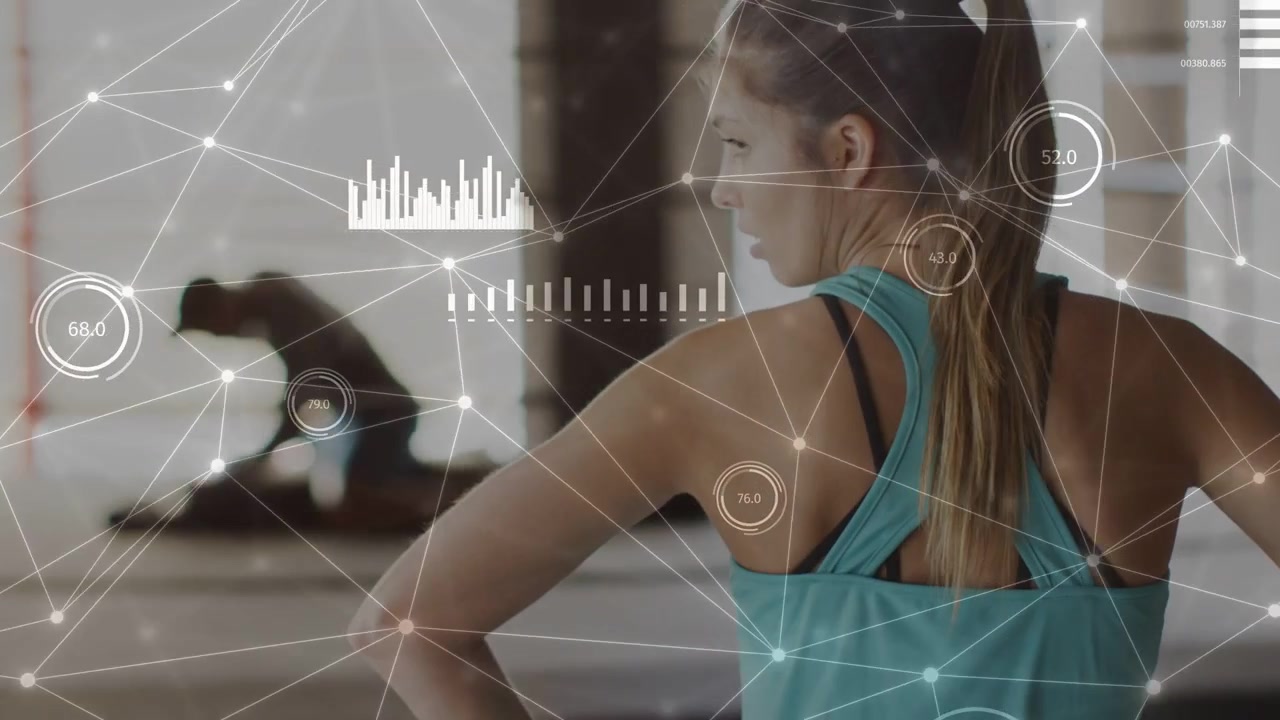 Vertical video: HUD appearing woman in turquoise tank red wraps coaching man adjusting mat at gym