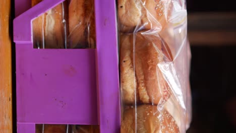 stacked burger buns in plastic bags