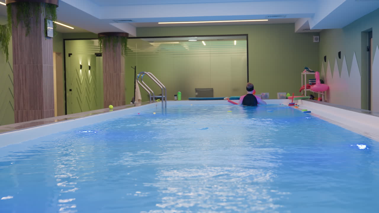 Stunning view of swimming pool environment, clear water with blue ripples, sunlit deck, clean tiles, bright reflections, palm shadows, loungers nearby, tranquil resort vibe, minimal architecture
